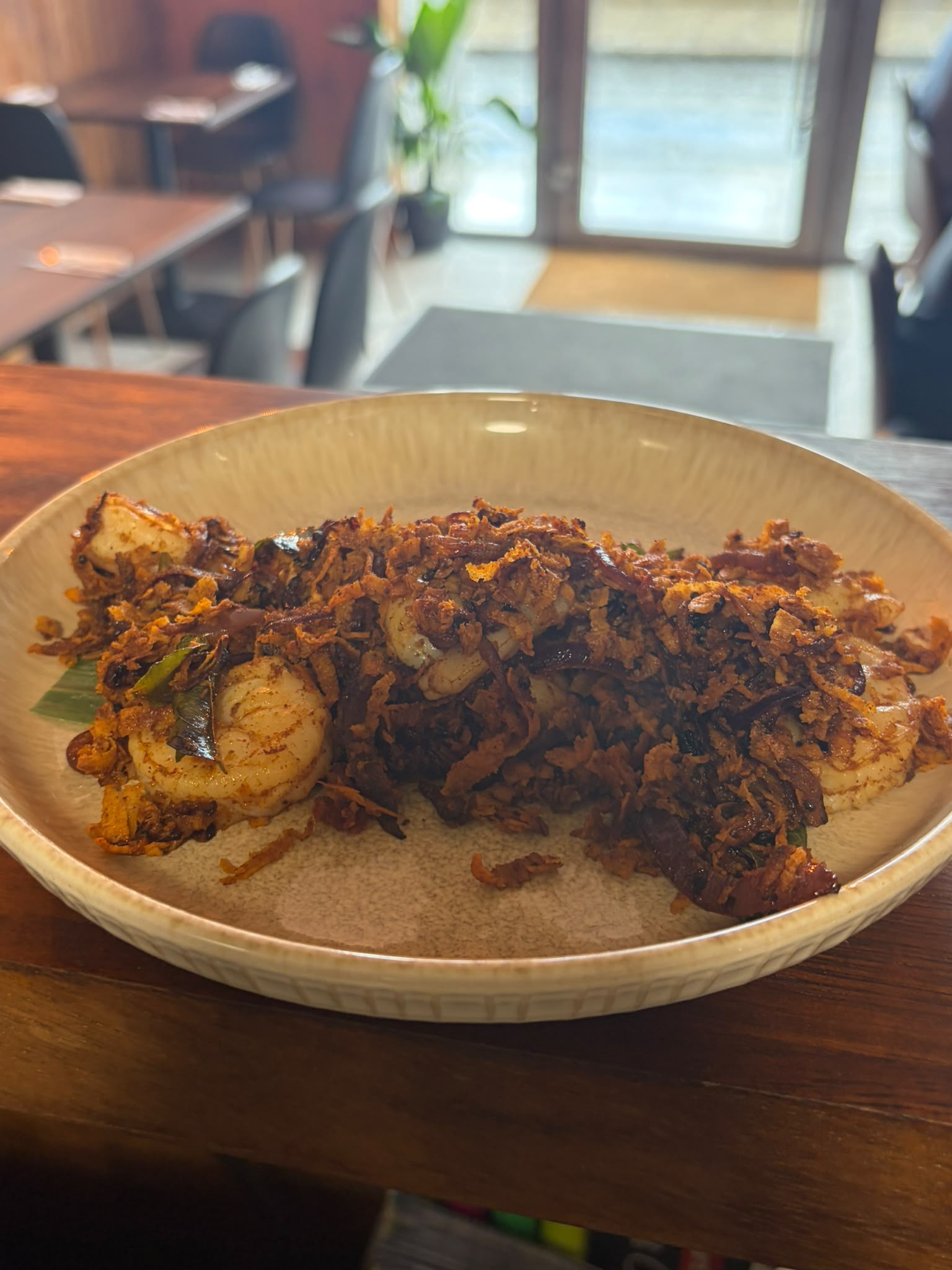 Prawn roast with crispy onions